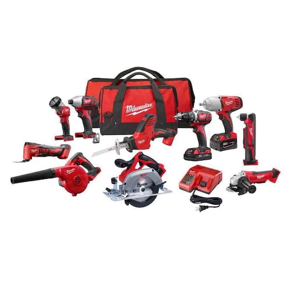 a set of milwaukee cordless power tools with batteries, charger, and a red carrying bag displayed on a white background.