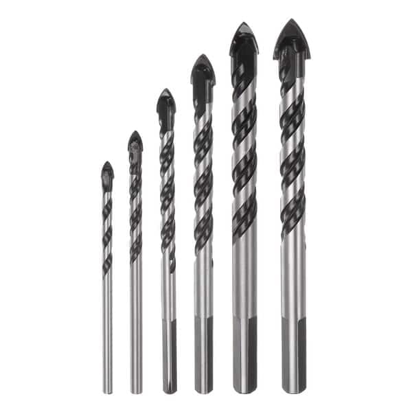 six masonry drill bits of varying sizes are arranged upright in order from smallest to largest against a white background.